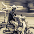 An image of someone delivering food on their motorcycle.