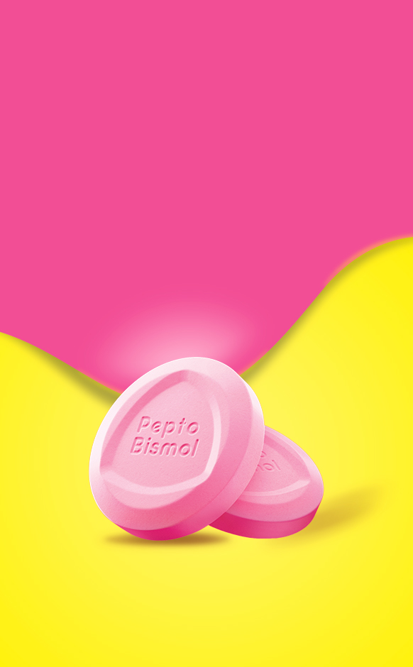 Two pink Pepto Bismol chewable tablets on a bright yellow and pink background.