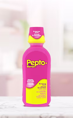 Pink Pepto-Bismol liquid bottle with yellow cap and label, offering 5 symptom relief for nausea, heartburn, and indigestion.