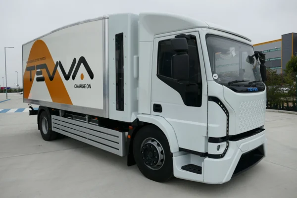 Tevva launches in mainland Europe and unveils a 19-tonne hydrogen electric truck. 

•Tevva officially launches in mainland Europe at the IAA Transportation show in Hannover, Germany
•Tevva continues to expand customer offering with the unveiling of a 19-tonne hydrogen electric truck at the world-renowned trade fair for commercial mobility, transport and logistics industries
•Adding a 19-tonne truck model means Tevva can target decarbonisation of the entire medium-duty truck segment 
•Tevva is joined in Hannover by several customers, including Kinaxia Logistics,  Codognotto and FM Logistic


Sunday 18 September 2022: Electric and hydrogen truck OEM Tevva will unveil its 19-tonne(19t) hydrogen-electric truck and announce its strategy for mainland Europe at the  IAA  Transportation show in  Hanover,  Germany, from  Monday  19 September. 

The company is partnering with its broad portfolio of customers, including Kinaxia Logistics, Codognotto and FM Logistic, to showcase its range of full-electric and hydrogen-electric medium-duty (7.5t to 19t / Class 5 to 8) truck solutions designed for the European market. 

Its largest truck platform launch to date, Tevva’s 19t hydrogen-electric model, represents a significant milestone and highlights the scalability of its technology. As with the 7.5t hydrogen-electric model,  the  19t variant benefits from the company’s revolutionary dual energy system, combining lithium-ion batteries and a hydrogen fuel cell range extender. The truck is expected to have a range of up to 500km depending on the number of hydrogen cylinders specified, which can be refilled in 10 minutes. 

Tevva is pioneering a practical hydrogen fuel cell application unique to medium-duty trucks. By adding a hydrogen fuel cell range extender that replenishes the battery throughout the day, Tevva has created zero-emission urban trucks that eliminate range anxiety and can replace diesel trucks on all routes. The dual energy system also futureproofs Tevva and its customers as Europe transitions away from fossil fuels and looks to decarbonise the transportation sector. 

Tevva believes hydrogen has strong potential to be a crucial part of the renewable energy mix for commercial transportation in Europe. Major European governments, like Germany, France and the UK, have all committed to hydrogen strategies resulting in significant inward investment.  Tevva is investing in and partnering with stakeholders from the hydrogen value chain to develop a turn-key solution to accelerate hydrogen-electric truck adoption. Tevva is aiming to make green hydrogen simple, safe and cost-effective for its customers by managing the energy procurement for them. 

The company has already started production at its UK facility, where it has begun to build European vehicles. Work is underway for a second facility in mainland Europe, utilising Tevva’s agile low-Capex, rapid implementation production system and double manufacturing capacity to 6,000 trucks per year by 2024. 

Each facility will produce 7.5t to19t (Class 5 to 8) trucks for customers in the UK, Germany, France, Spain, Italy and Benelux. Tevva will start in these markets before expanding its reach into other parts of Europe, North America and the Middle East. 

Tevva Founder and  CEO Asher  Bennett said: “Tevva’s momentum continues. We have already rolled out two 7.5t truck models in the last year and are now unveiling our 19t hydrogen-electric truck offering. 

The19t truck market is a vast and exciting opportunity for Tevva in Europe. We have created a truly differentiated product and service offering to complement the needs of our European customers. We have already received significant interest in the 19t model and look forward to collaborating with our customers and industry partners to create a pan-European fleet electrification ecosystem. 

We are on a mission to make sustainable trucks accessible at scale and believe our technology will empower the transport sector and the governments of Europe to meet their net-zero goals. By embracing hydrogen, we can rethink the energy mix in transport, reduce strain on our electricity grid and accelerate electric truck adoption. Through Tevva, the future is within range.” 

Alfonso Lopez, Transport Director FM Logistic Ibérica, said: “From FM Logistic are proud to collaborate with Tevva in this project. Both companies share ambitions of innovation and sustainability that, in the medium term, will lead to great projects in Europe. Supply chain is an essential link in our globalised world. 

What we do directly affects people, cities, society, and the world we all live in. By Supply Change, we mean turning the supply chain into an omnichannel and sustainable ecosystem. That serves one purpose: make responsible consumption available for all.”

Matteo Codognotto, Marketing & Innovation Group Director at Codognotto, said: “The decarbonisation of the transport stands out among the objectives of the EU, which is pushing for alternative solutions to traditional technologies and fuels -core activities within the Codognotto Innovation Team. 

When we met Phil Henrick -Sales and Aftersales Director at Tevva Electric Trucks -within the ALICE (Alliance for Logistics Innovation through Collaboration in Europe) working table, our team was investigating the progress of the electric freight solution on the market. Tevva’s electrification proposal perfectly met our needs, allowing us to approach this new green world through a testing and evaluation program. 

We are happy today to bring our experience to the IAA, demonstrating how the commitment by electric vehicle manufacturers and transport companies is more concrete and tangible than ever, but the road to decarbonisation still faces many challenges. 

We will reach the goal of zero-emission transport only thanks to a strong synergy between the public and private sectors: we are ready to make some substantial investments, but we need support in terms of public funding and adequate infrastructures to use sustainable heavy-duty vehicles on our roads.”

Kinaxia Logistics Chief Executive Simon Hobbs said: “As a large and growing transport organisation, we are constantly looking at ways to improve our environmental performance, particularly concerning CO2 emissions. 

Over the years, we have implemented several measures, including better vehicle utilisation, driver training and trialling different fuel types. As a result of our collaboration with Tevva, we have the opportunity to trial our first electric vehicle as another element of our overall environmental reduction strategy. 

We are very grateful to Tevva for providing this opportunity, and we are excited to test the truck and explore this option further. It’s been a pleasure being involved in the project and working alongside the Tevva team. We wish them every success with the launch of the vehicle.”



Notes to editors: 


Media enquiries:

SEC Newgate 
Ian Silvera (+44 (0) 7703 846 164) / Elisabeth Cowell (+44 (0) 7900 248 213)
Email: Tevva@secnewgate.co.uk


Specifications of the hydrogen-electric vehicle:

•The range will be up to 500 kilometres or 310miles, depending on the number of hydrogen cylinders specified 
•Hydrogen refuelling in 10minutes 
•Comprehensive telematics enable continuous monitoring of systems 
•Left or right-hand drive, according to need 


Hydrogen fuel cell facts:
•Existed in one form or another since the 19thcentury.
•Around 50,000 hydrogen fuel cell passenger cars have been sold worldwide 


About Tevva: 

“We do technology because it matters and makes a difference to humanity.”

Tevva is an electric truck company with a  spectrum of options for zero-emission medium to heavy-duty trucks. Our revolutionary hydrogen fuel-cell range extension technology allows our vehicles to do all the work of a diesel truck with total peace of mind about cost, range and environmental impact. Tevva is leading the drive to zero-emissions freight and urban logistics. We have vehicles on the road already, getting the job done, and are focused on optimising green hydrogen solutions as part of our proposition.www.tevva.com