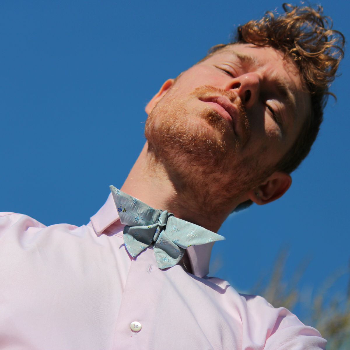 Man wearing an origami butterfly bow tie