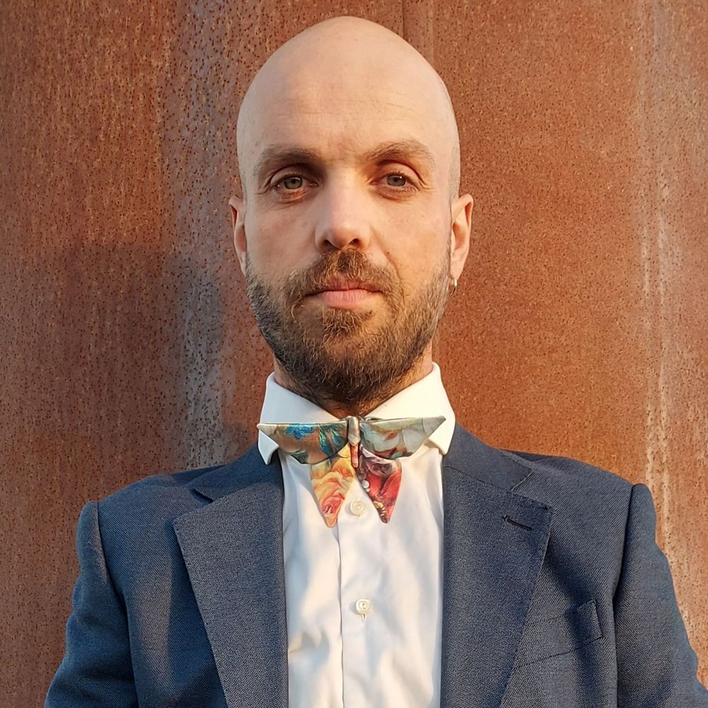 man wearing a floral origami bow tie