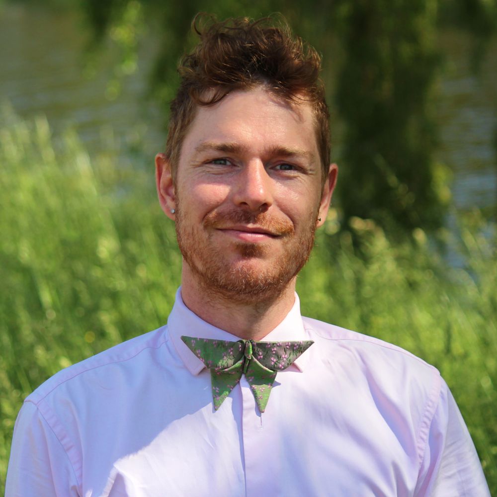 Man with an origami butterfly bow tie in the nature