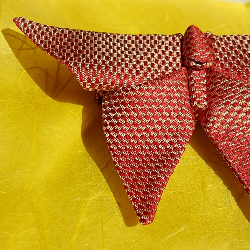 Close up of a silk origami butterfly bow tie
