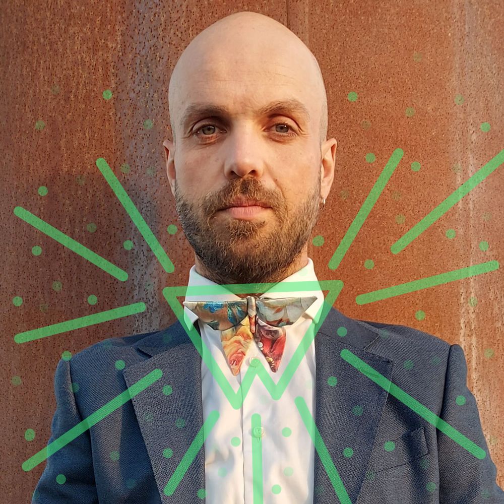 man wearing a floral origami bow tie