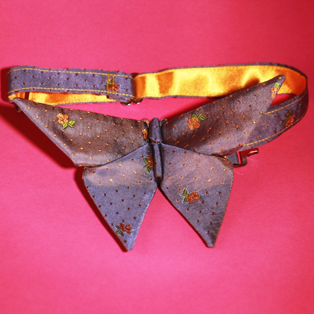 Origami inspired butterfly bow tie with a satin finish on a neck tape