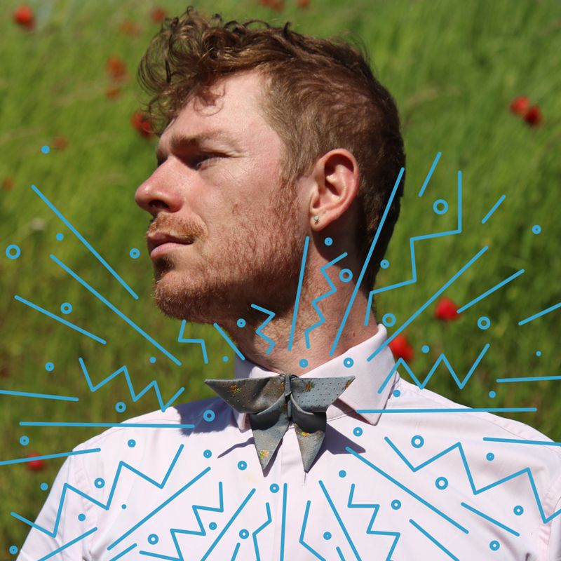 Stylized picture of a man wearing an Origami inspired butterfly bow tie 
