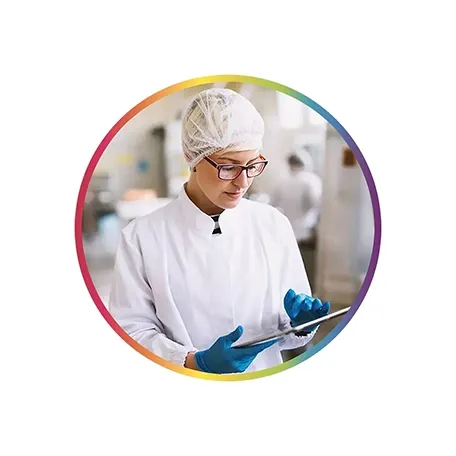  Woman in protective gear checking a clipboard in a lab