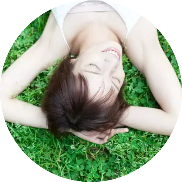 Young woman lying in grass