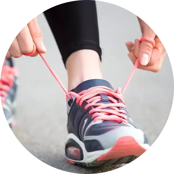 Woman tying shoelaces before running