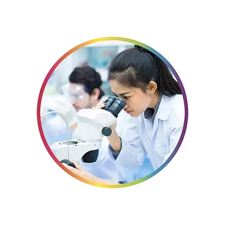  Woman looking in a microscope in a lab