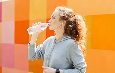 Young woman drinking water