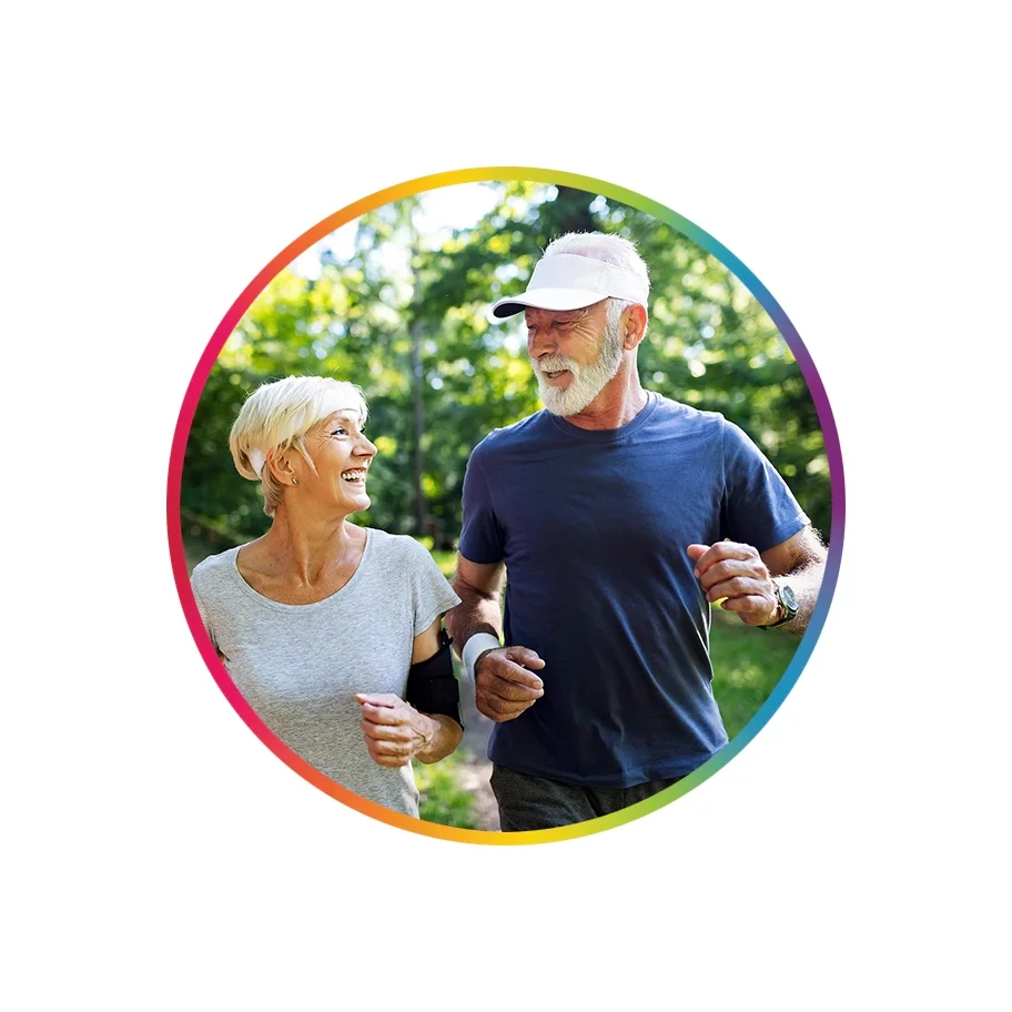  Older couple walking in park