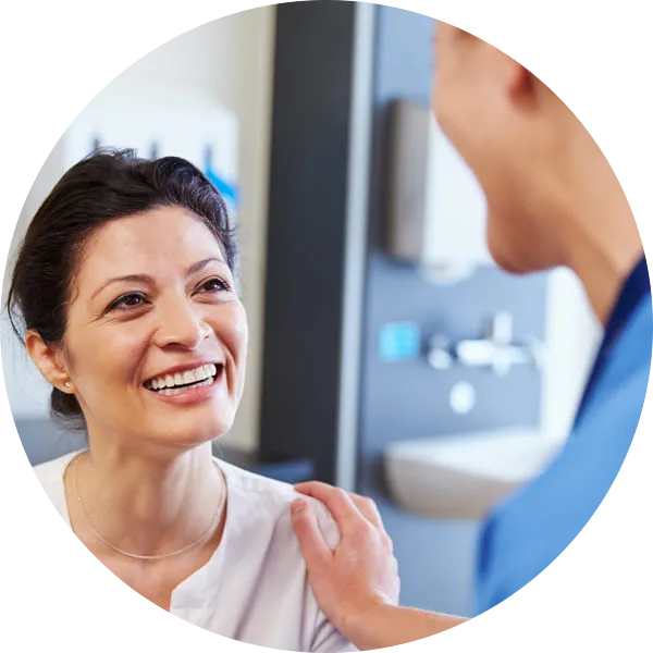 Female patient being reassured by doctor
