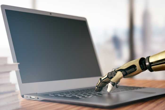 robot-hand-on-laptop