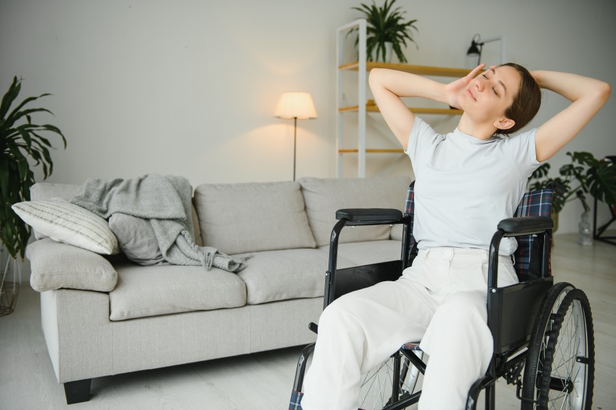 woman-in-wheelchair-working-out-in-living-room-2023-12-05-04-13-24-utc.jpg