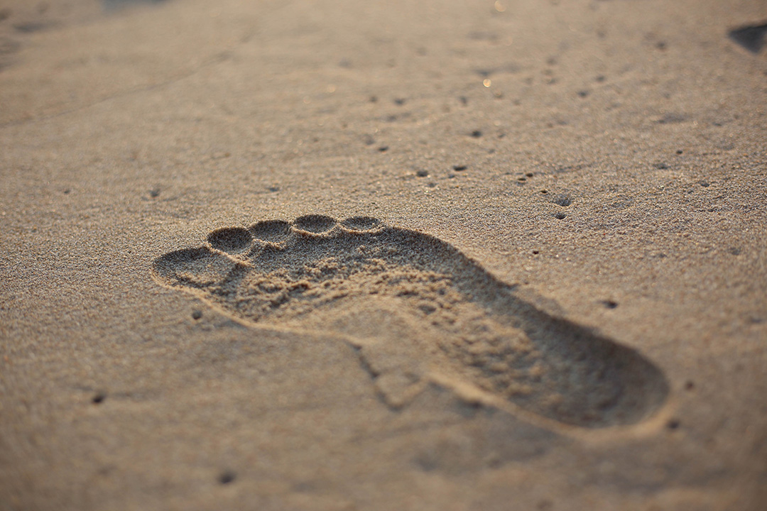 Im Sand zu sehender Fußabdruck.