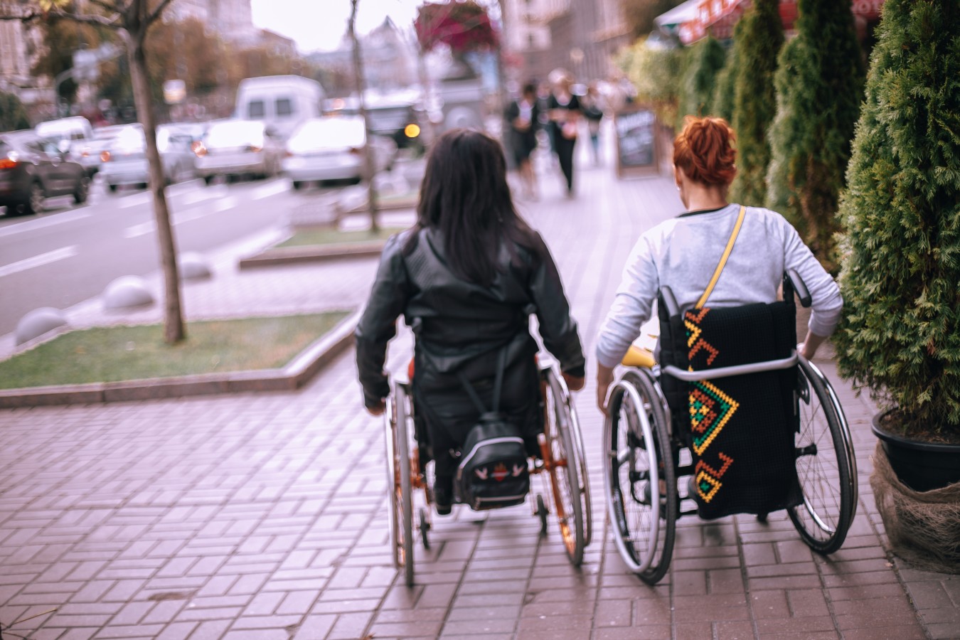 girls-on-wheelchairs-in-a-big-city-near-the-road-w-2023-11-27-05-09-35-utc.jpg