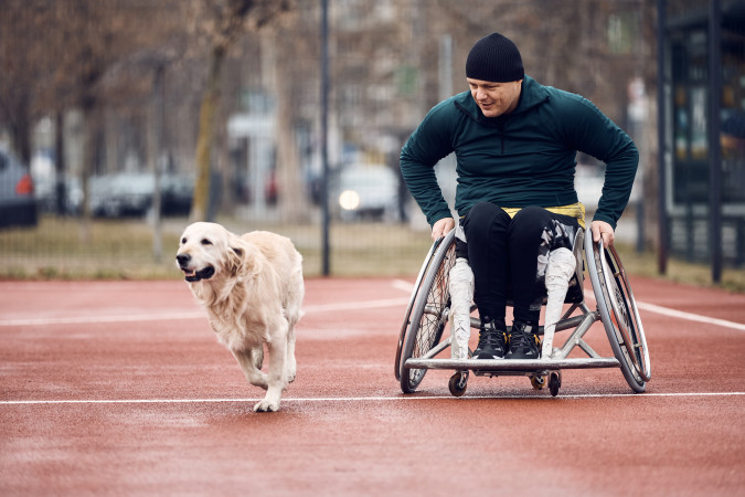 wheelchair-bound-athlete-and-his-assistance-dog-on-2023-11-27-05-26-43-utc.jpg