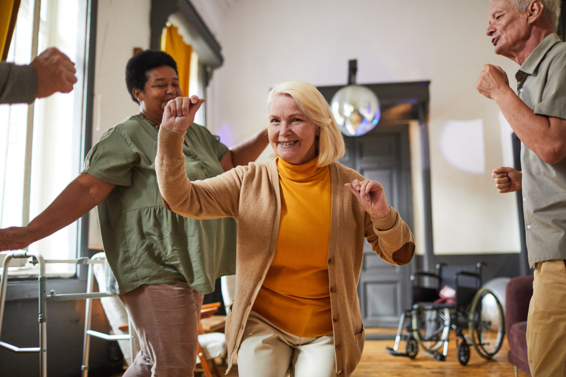 happy-seniors-dancing-in-retirement-home-2023-11-27-05-33-05-utc.jpg