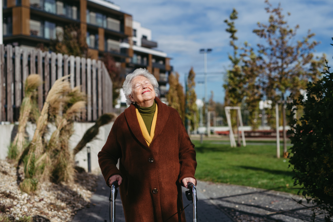 senior-woman-with-a-mobility-walker-walking-on-cit-2023-11-27-05-10-15-utc.jpg