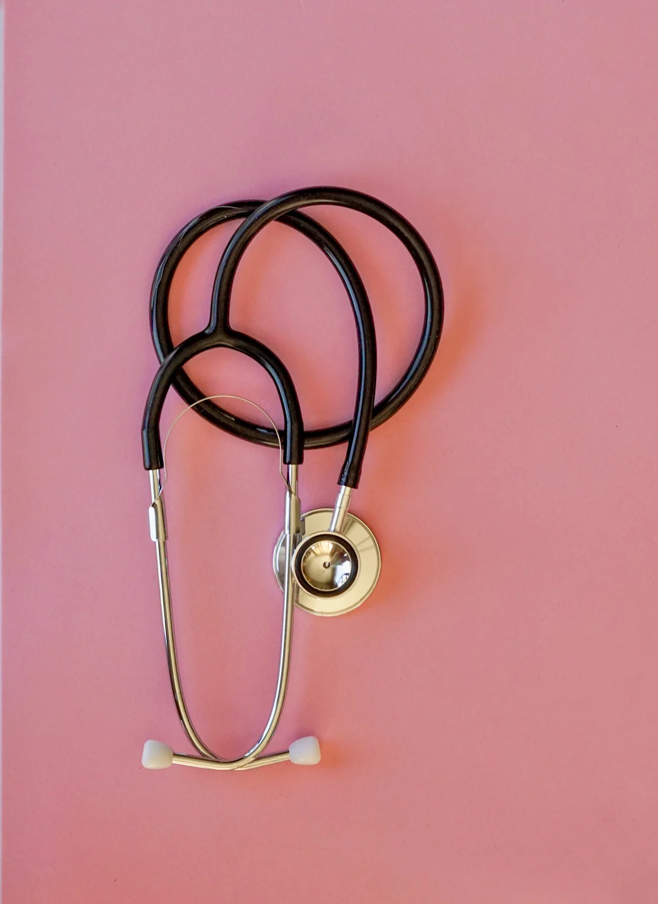 overhead-view-of-a-stethoscope-on-a-pink-backgroun-2025-01-10-16-37-58-utc