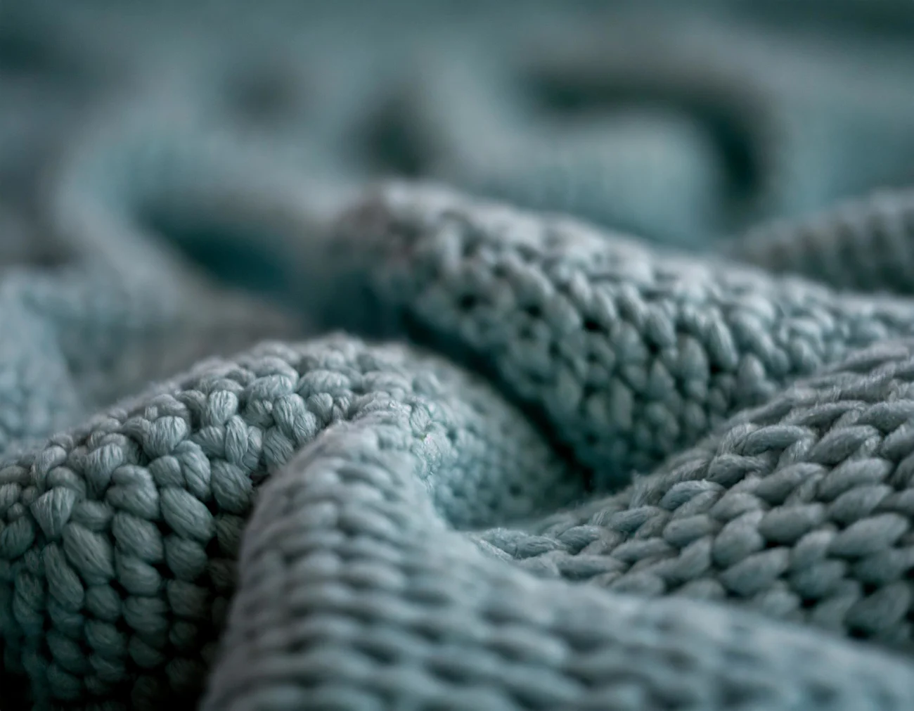 Firefly fabric, knitted, close-up, dusty blue green shades 60338