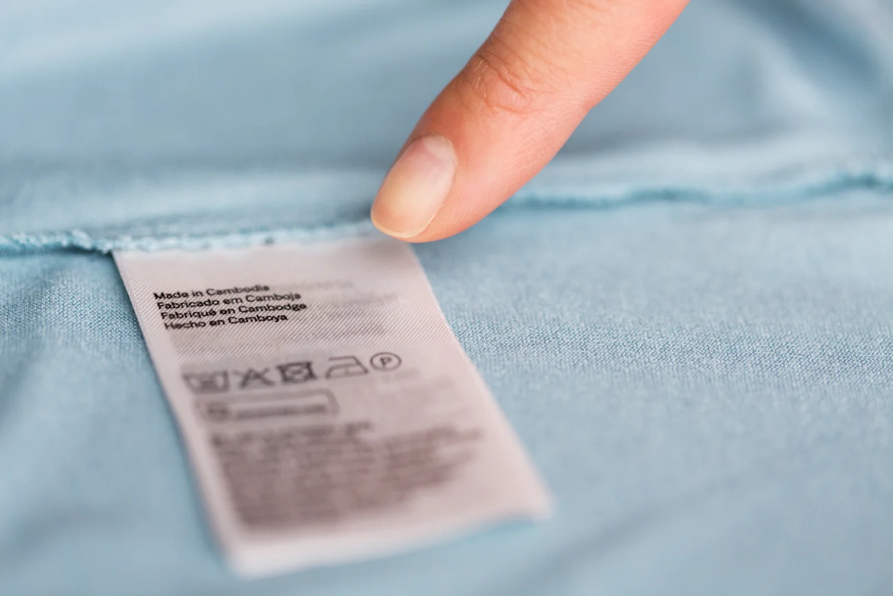 finger-pointing-to-users-manual-of-clothing-2024-09-27-19-00-55-utc