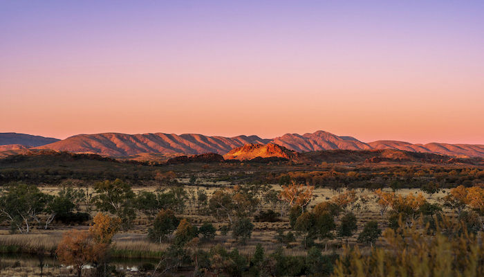 West Macdonnel Ranges from the viewpoint of Mt Sonder at sunset, Central Australia.