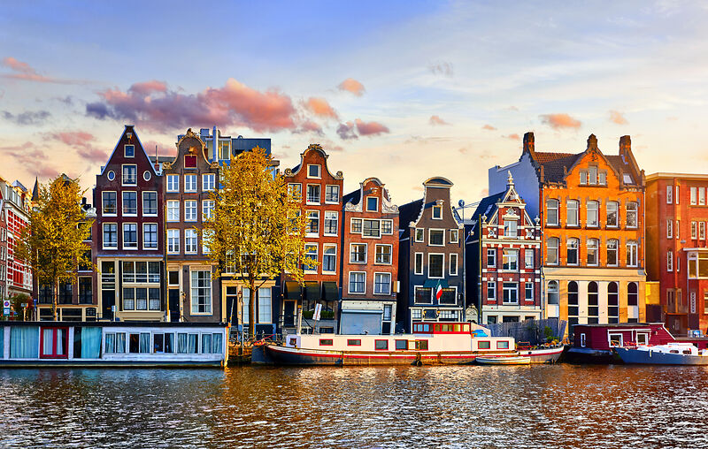 Amsterdam Netherlands houses over river Amstel landmark in old european city spring landscape
