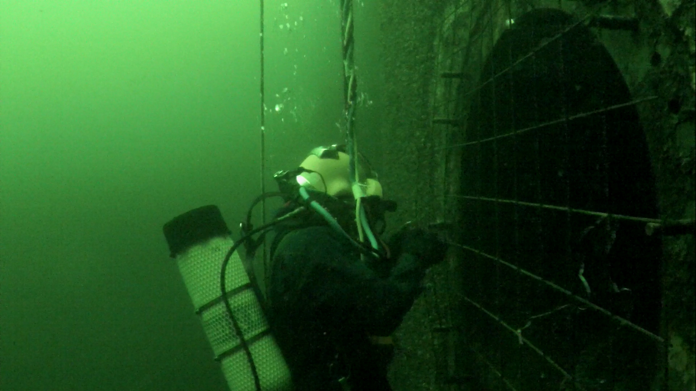 ROV Monitoring Salvage Diver at Hydro Dam. Demonstrates how ROVs can be a great way to monitor underwater construction. 
