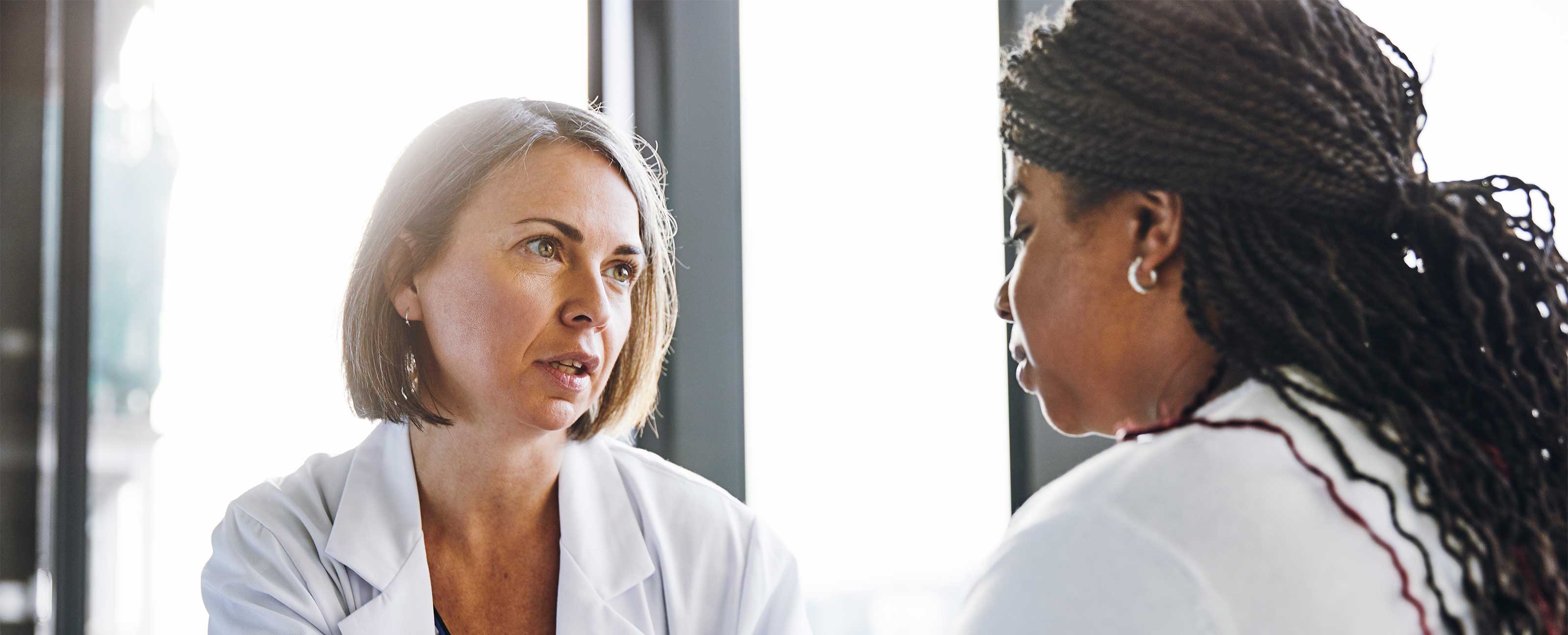 doctor speaking with patient