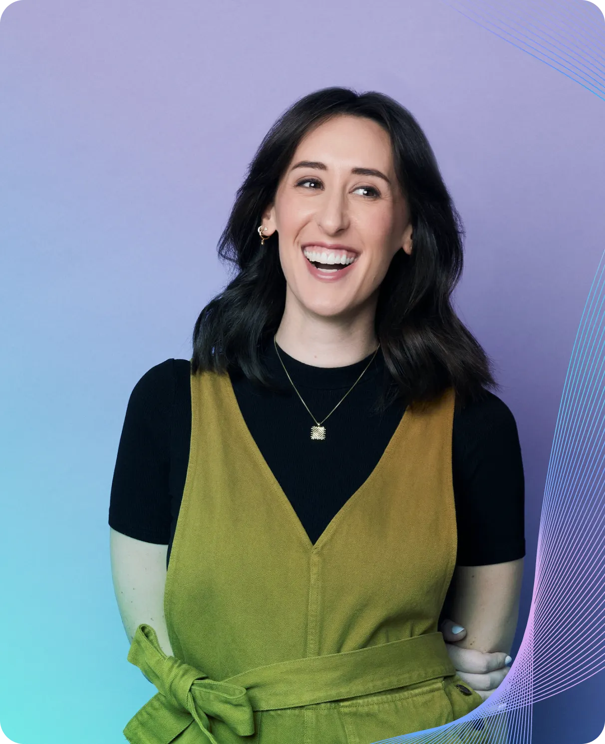 Ashley from Plaid smiling in front of a purple backdrop — sharing how trust and inclusion shape Plaid’s workplace culture