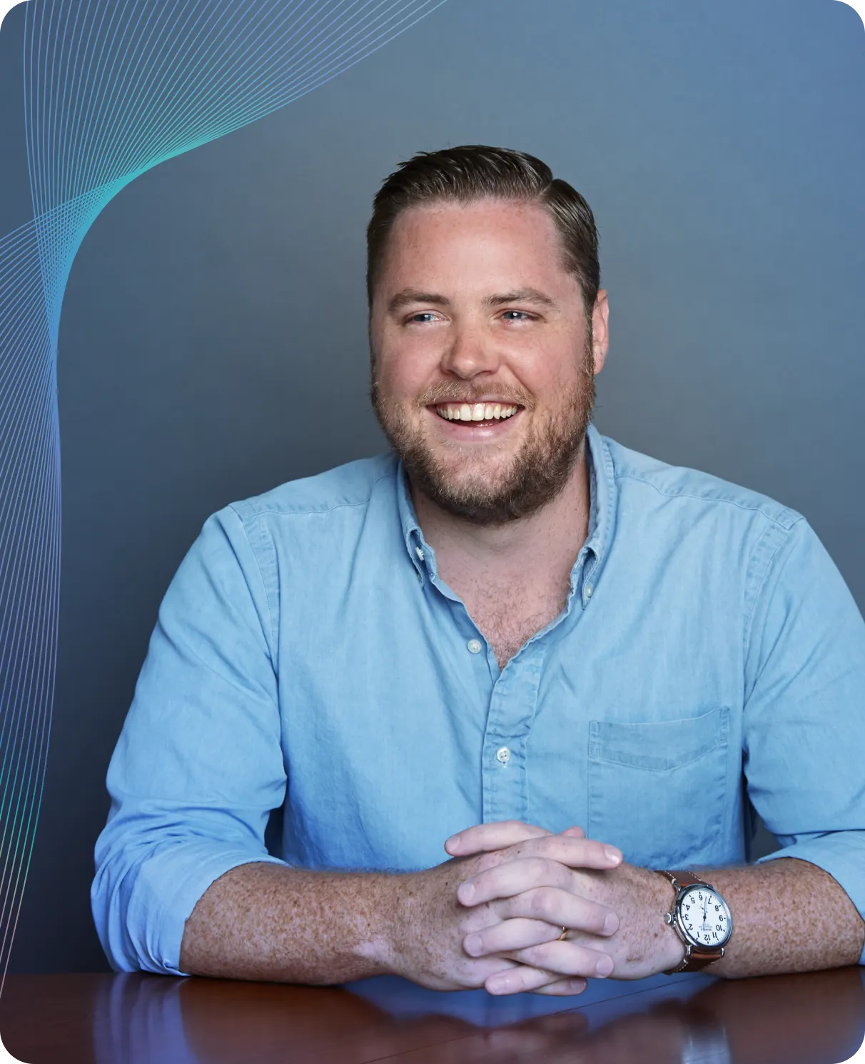 Matt from Plaid seated and smiling in a blue shirt — reflecting on how Plaid’s products resonate with developers and enterprises