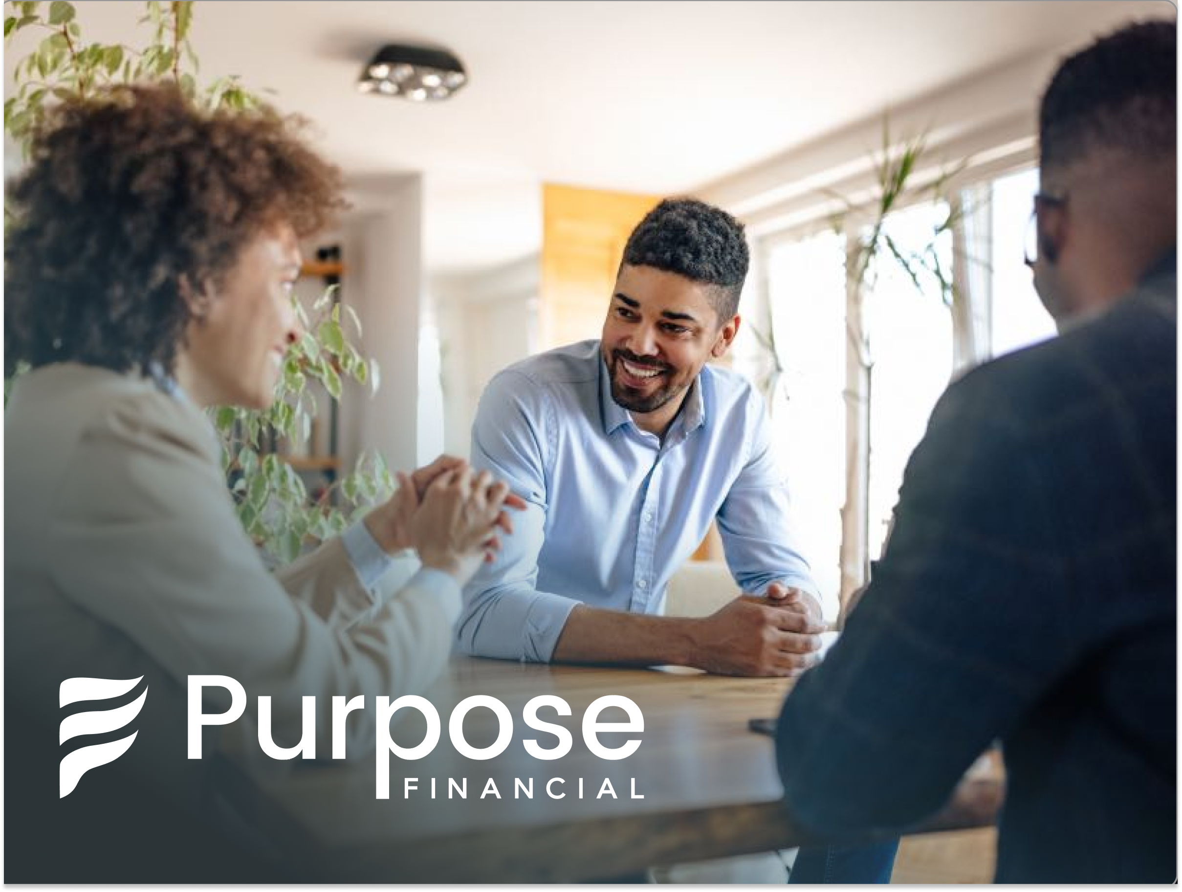 Three people sitting at a table in a well-lit office, engaged in a discussion. The person in the center is smiling and listening attentively. The Purpose Financial logo is prominently displayed at the bottom left of the image.