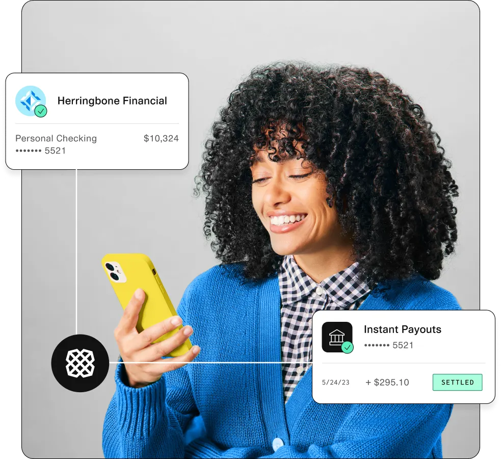 A joyful woman with curly hair holding a yellow phone, flanked by digital panels displaying her financial details with "Herringbone Financial" and "Instant Payouts" information. The design conveys seamless financial management and user satisfaction.