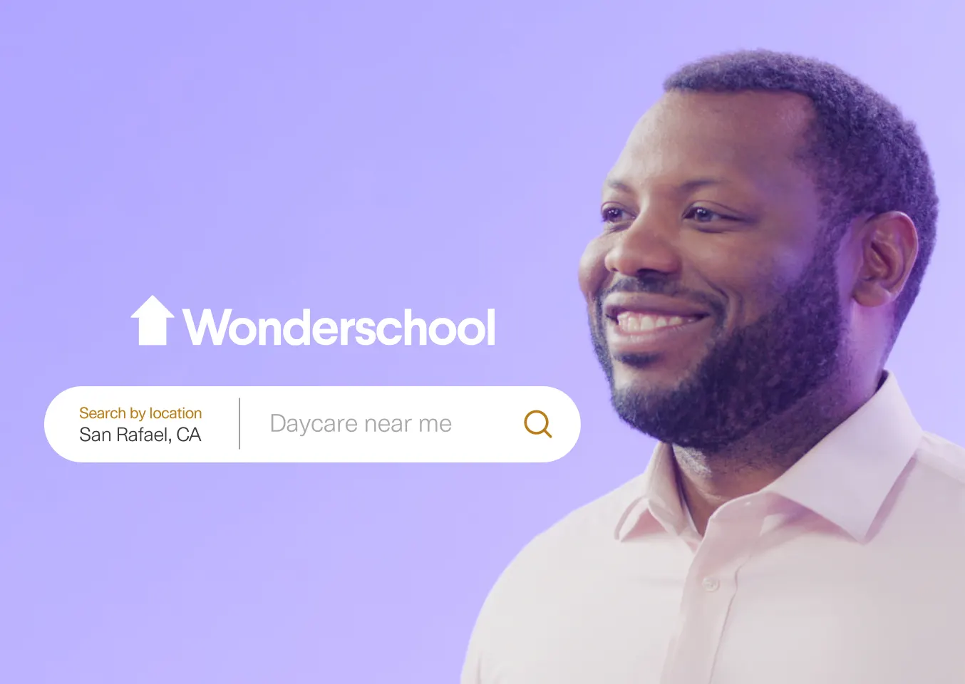 A man with a beard smiling on a purple background. The Wonderschool logo is displayed in white, along with a search bar that shows 'Search by location: San Rafael, CA' and a search query 'Daycare near me.' The search icon is highlighted in orange next to the man's profile.