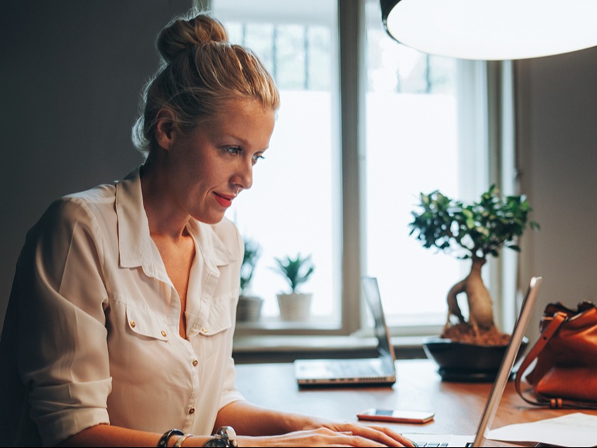Woman completing an online property valuation