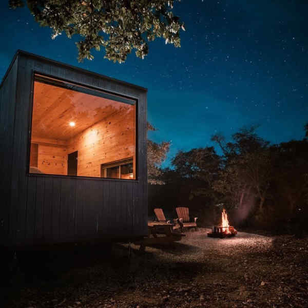 Outside Getaway cabin with campfire and chairs