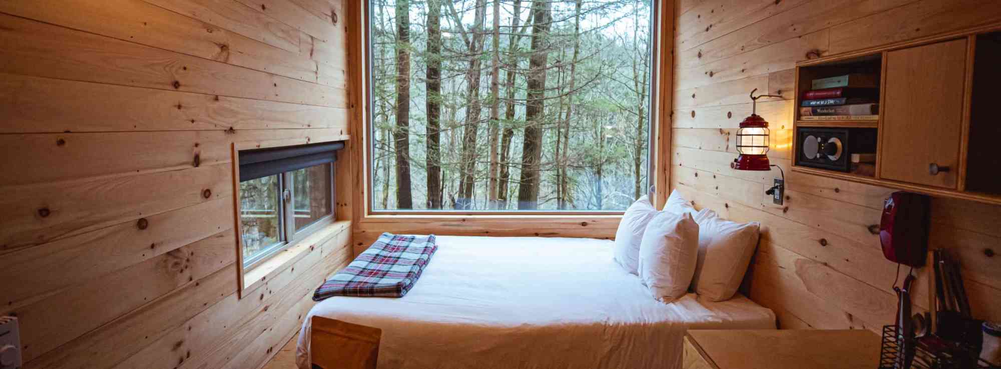Bed inside Getaway cabin, with window at Getaway Mount Adams near Portland, OR