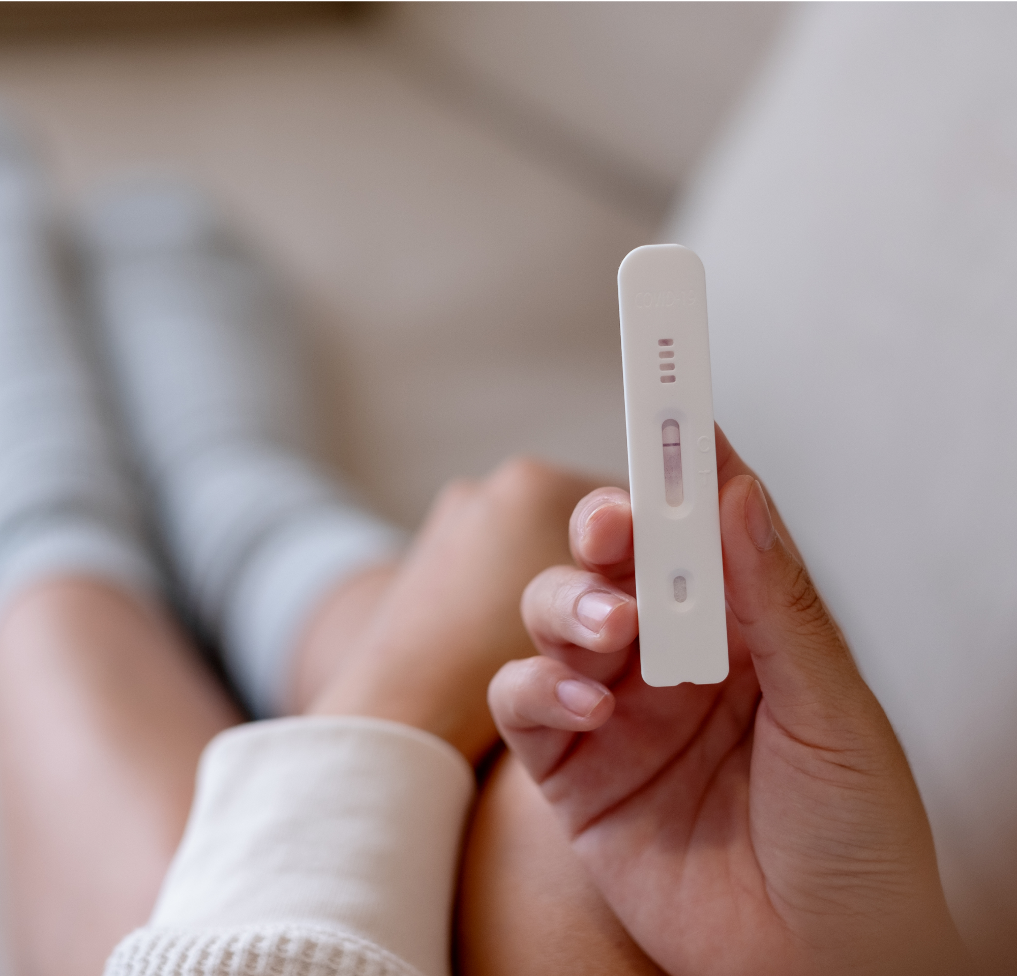 Woman holding a test kit