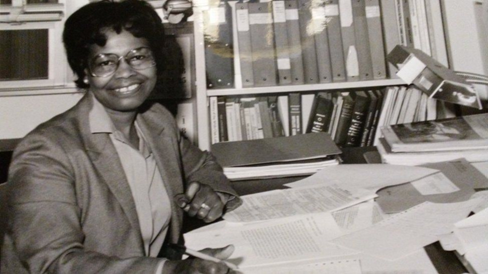 Black and white image of a woman in glasses