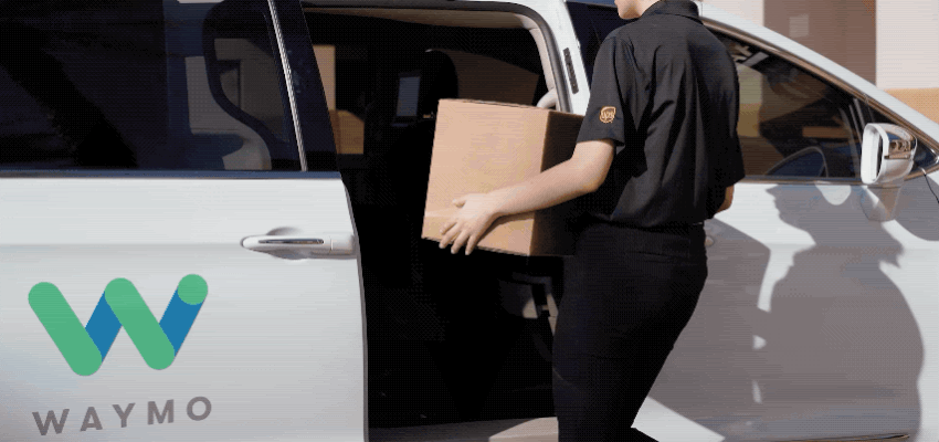 GIF of person loading a box into a Waymo car