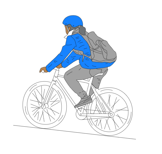 Girl riding bike in blue jacket and helmet