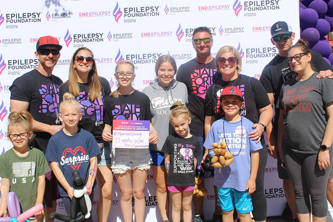 Group of people in front of a backdrop for the Epilepsy Foundation