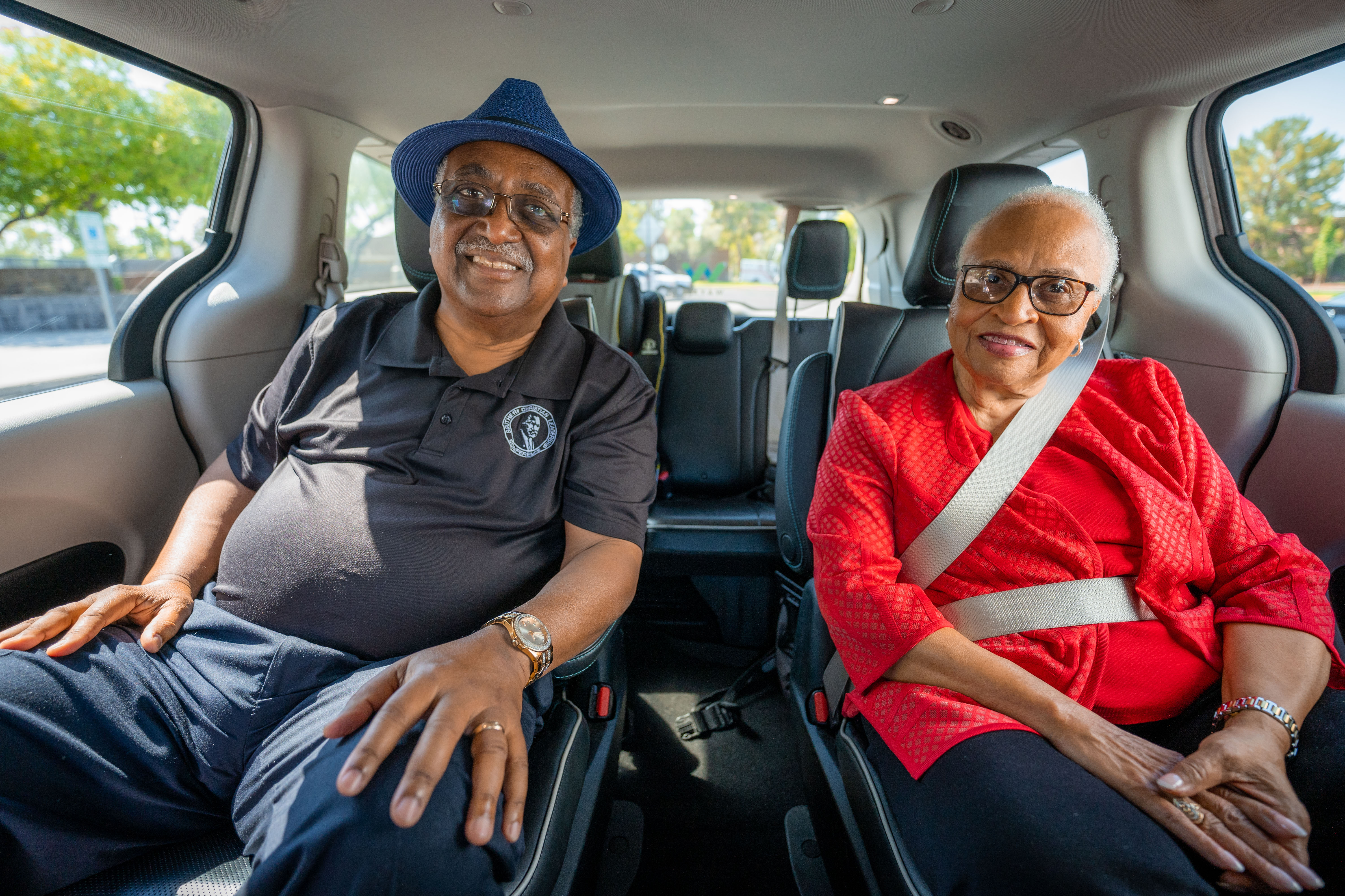 Woman and man sitting in a Waymo autonomous vehicle