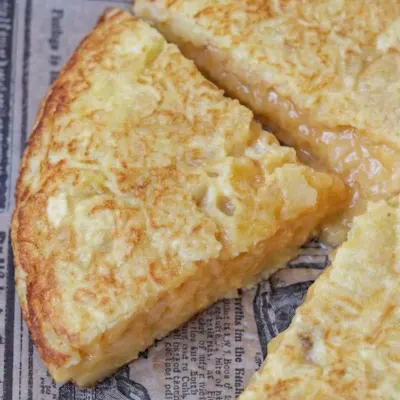 Tapa de la tortilla de Miguel (cuarto)