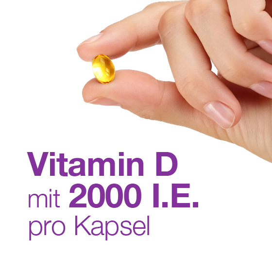 Hand hält eine goldene Kapsel; Text: Vitamin D mit 2000 I.E. pro Kapsel.