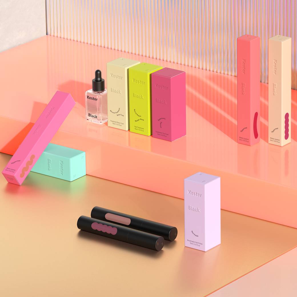 Close up image of Kester Black makeup, including eye liner and nail polish, arranged on a shelf