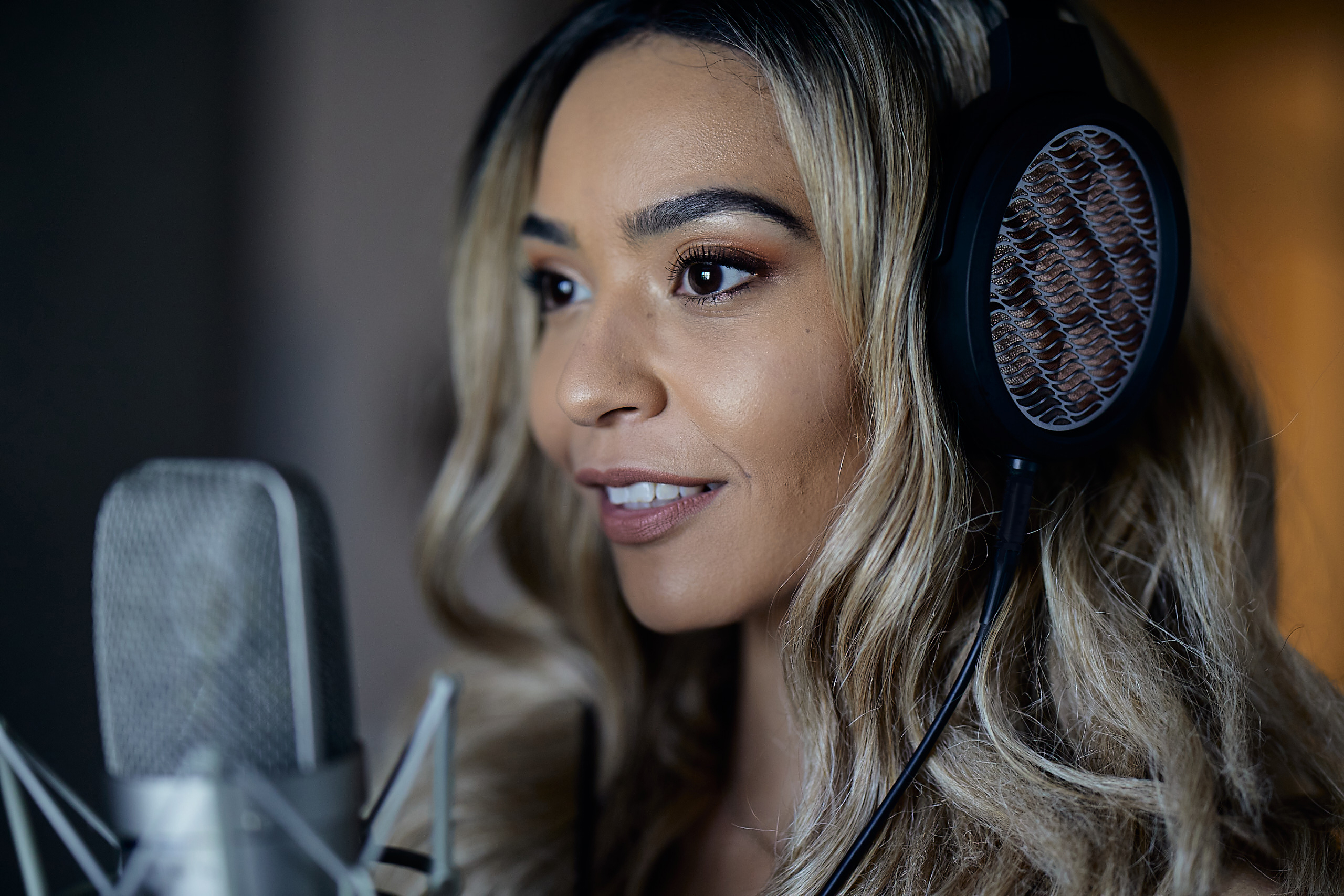 Julie Signing with BRAVURA Headphones 